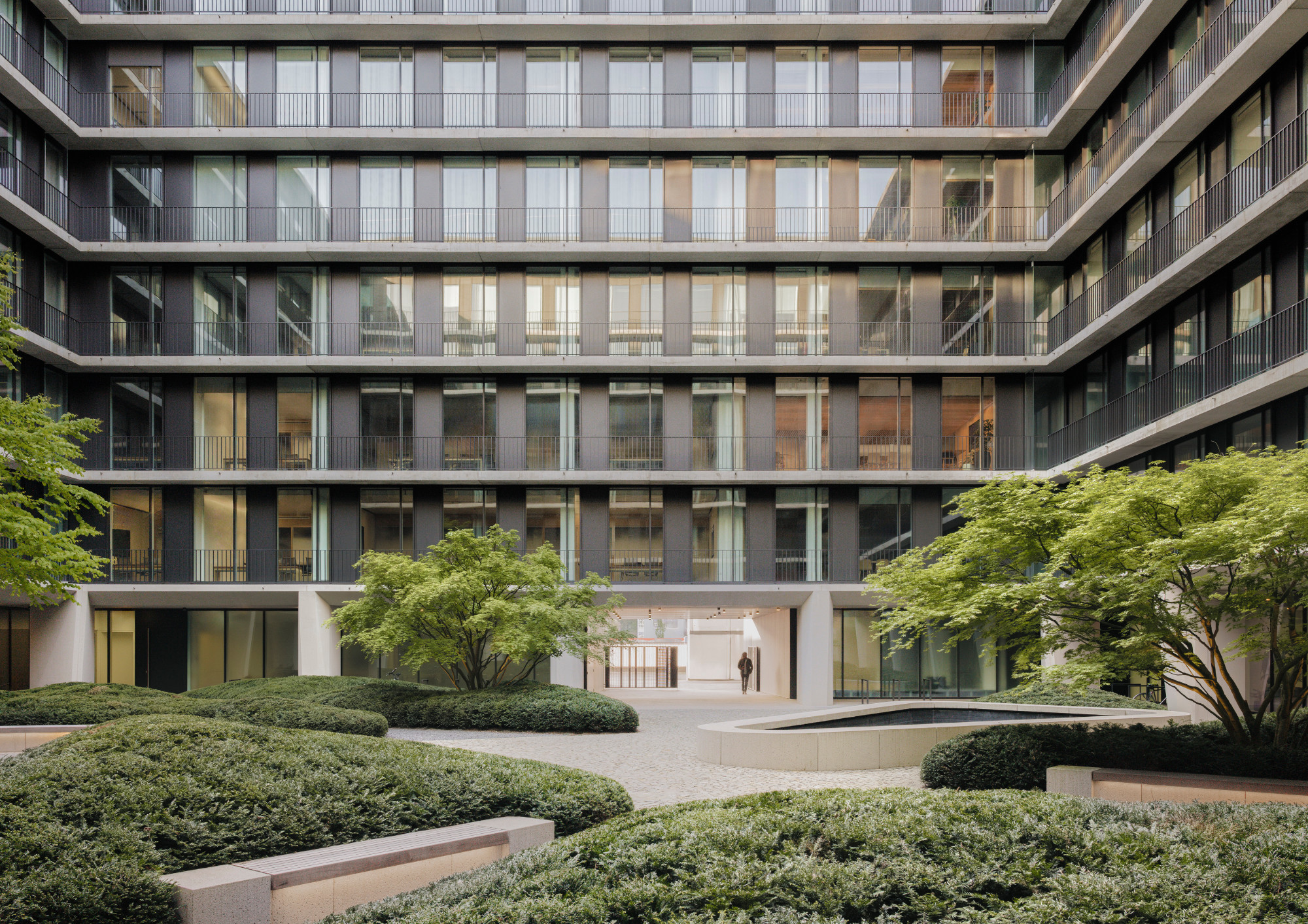 Completed building, courtyard, photographed in 2024